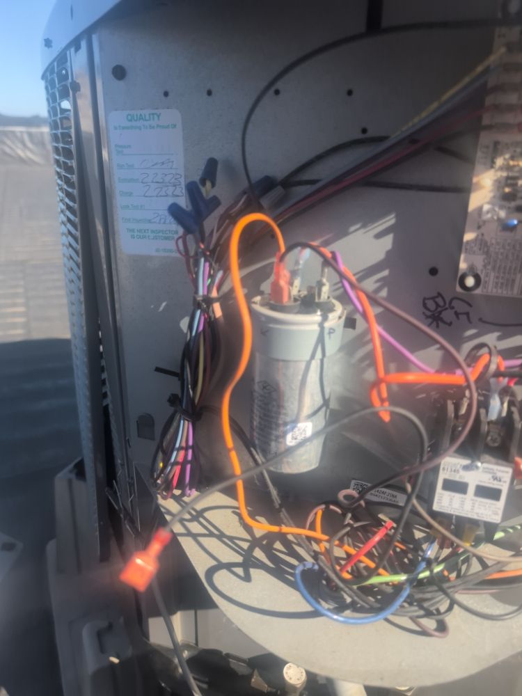 Run capacitor and contactor replaced, charge verified on a rooftop unit.