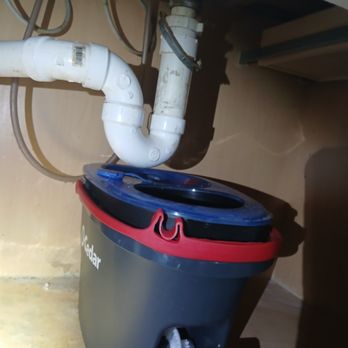 Trap and tailpiece rebuilt around a fresh disposal.